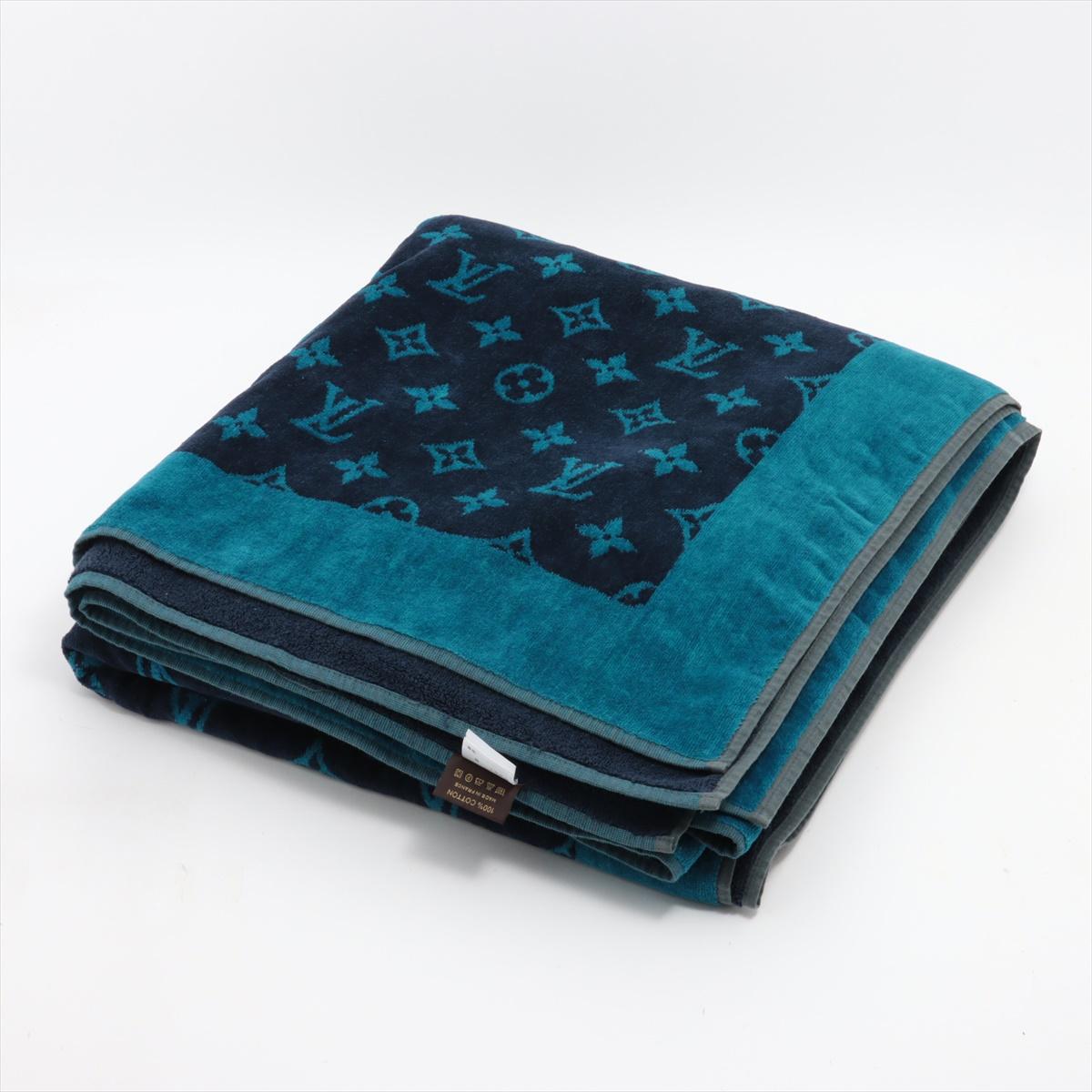 The Louis Vuitton Monogram Cotton Blanket in Navy Blue and Blue Green offers both comfort and style with its luxurious design. Crafted from soft and breathable cotton, the blanket features Louis Vuitton's iconic Monogram pattern on one side,