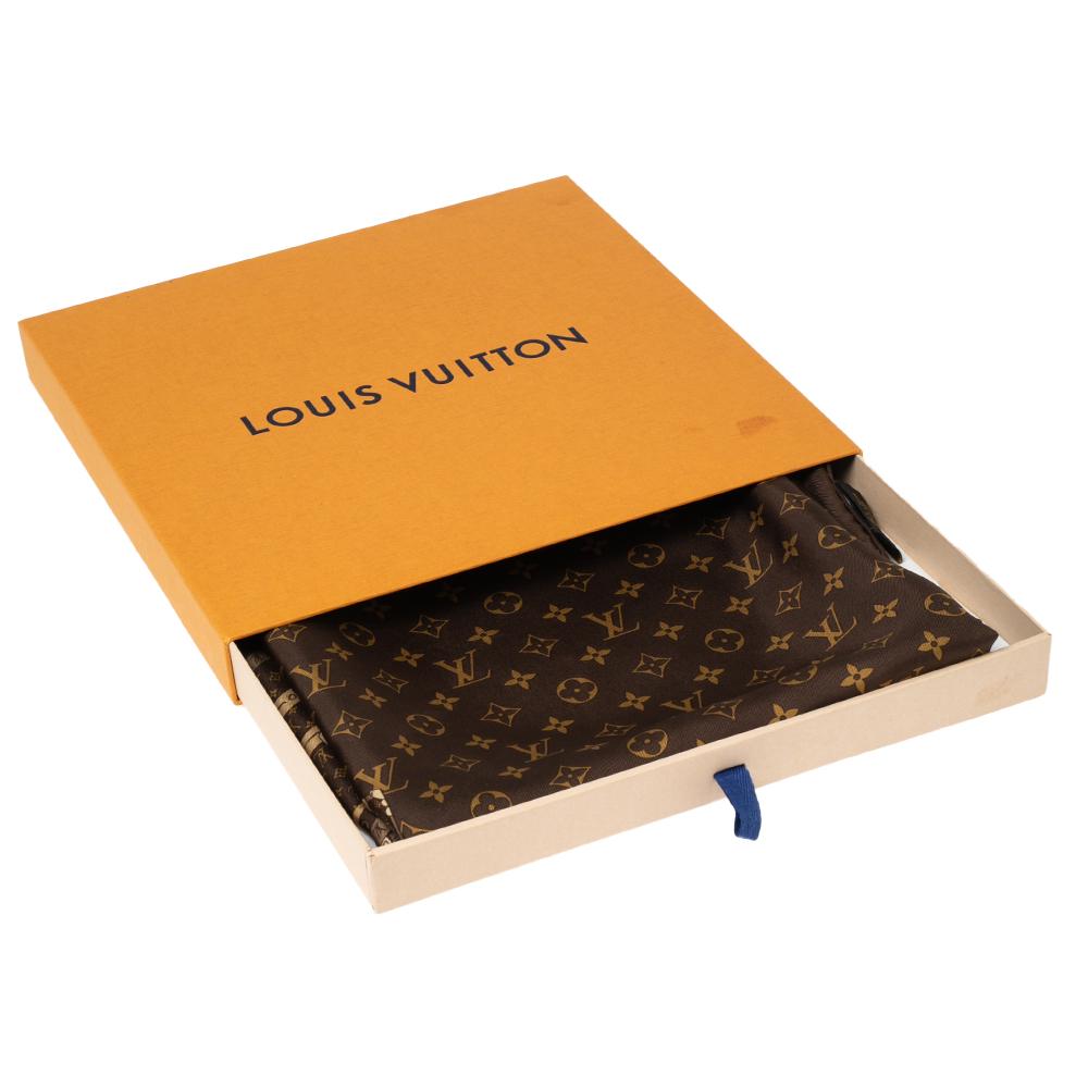 The delicate silk is classically printed with the traditional Monogram pattern and a series of iconic traveling steamer trunks, hatboxes, and bags at the four corners. Paying homage to the heritage of Louis Vuitton, this square-shaped scarf is the