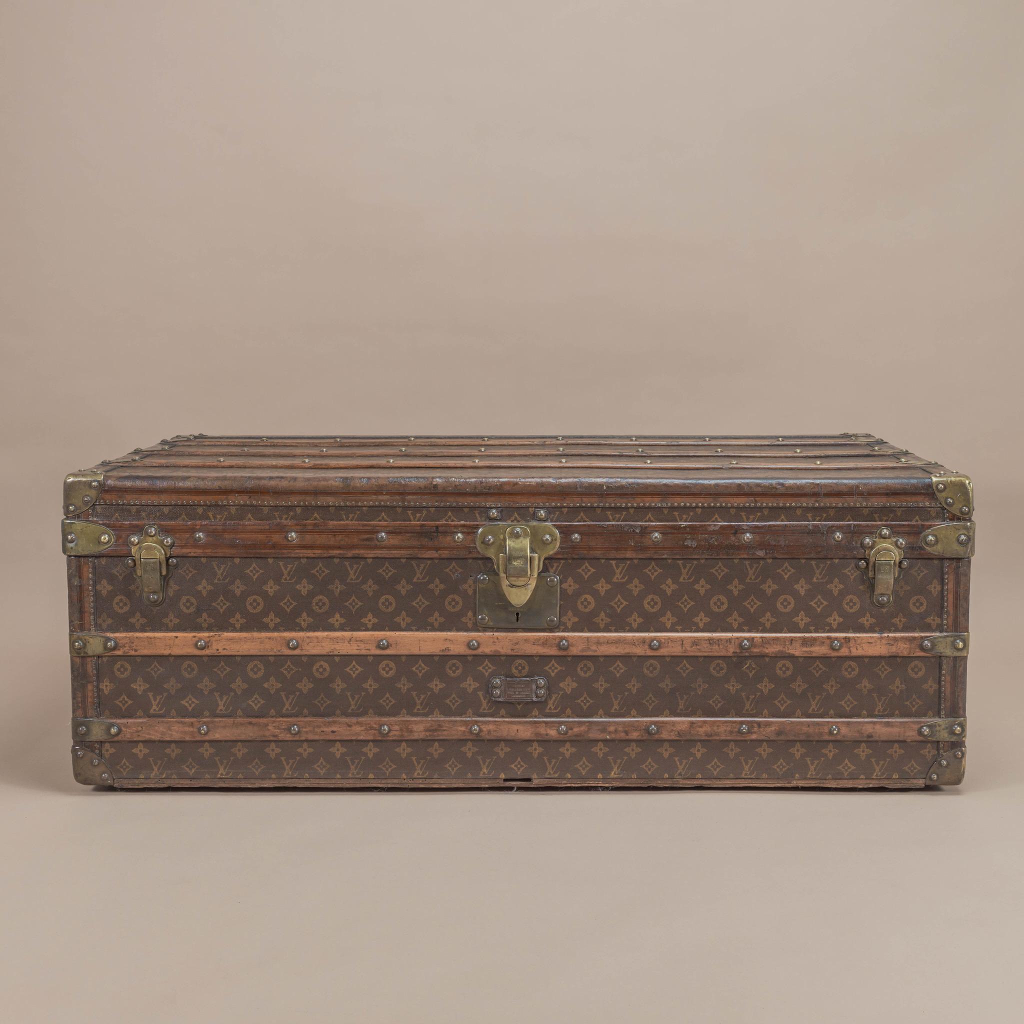 A wonderful brass bound Louis Vuitton LV monogram cabin trunk that is taller than usual and would be perfect as a coffee table. Comes complete with its original interior and tray. The brass fittings are nicely patinated and it has original leather