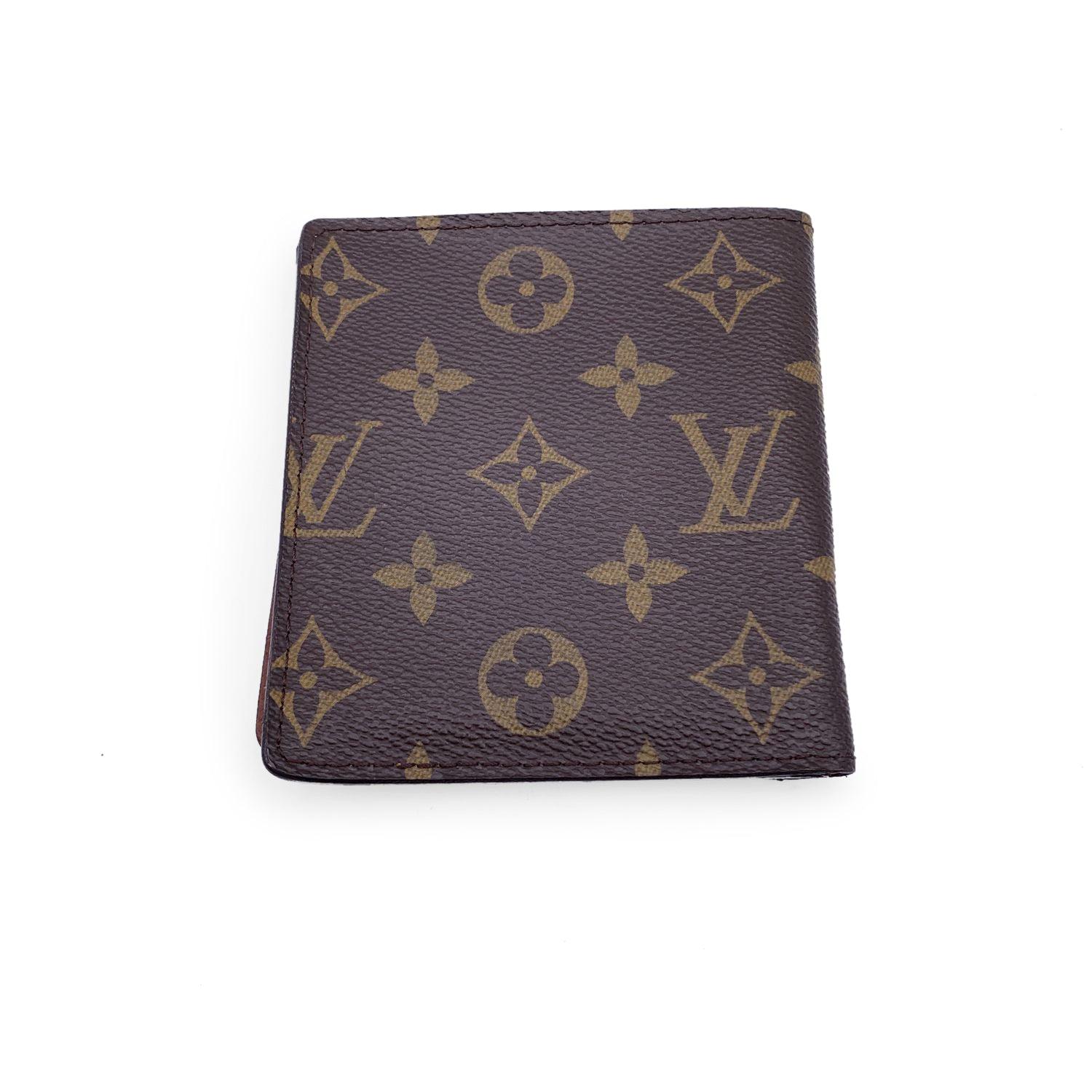Louis Vuitton monogram canvas Bifold Wallet Credit Card Holder. Bifold design. 1 bill compartment, 10 credit card slots inside. Leather lining. 'LOUIS VUITTON Paris - made in France' embossed inside. Authenticity serial number embossed inside the