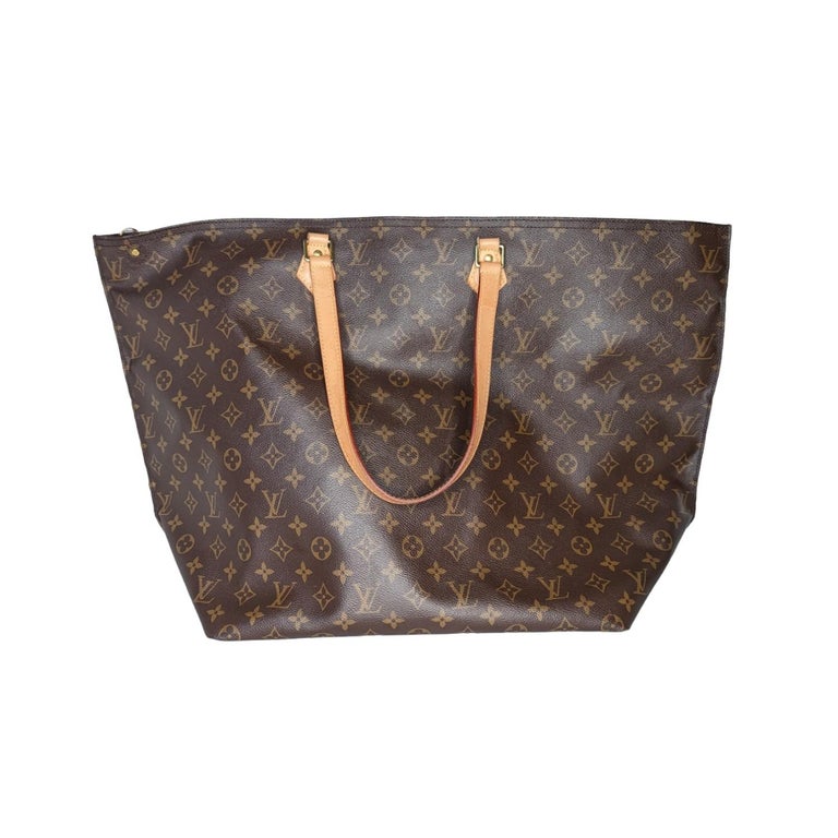 Brown and light brown Monogram coated canvas Louis Vuitton All-In GM tote with brass hardware, dual flat shoulder straps, tan vachetta leather trim, brown canvas lining, single zip pocket at interior wall and zip closure at top.

Designer: Louis