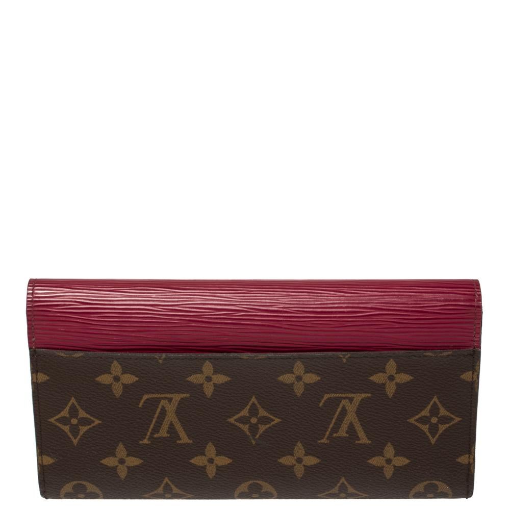 This Marie-Lou wallet comes from the iconic house of Louis Vuitton. It is crafted from monogram canvas and Epi leather, it comes with a flap that opens to a well-designed interior. It has several slots and compartments and is finished with