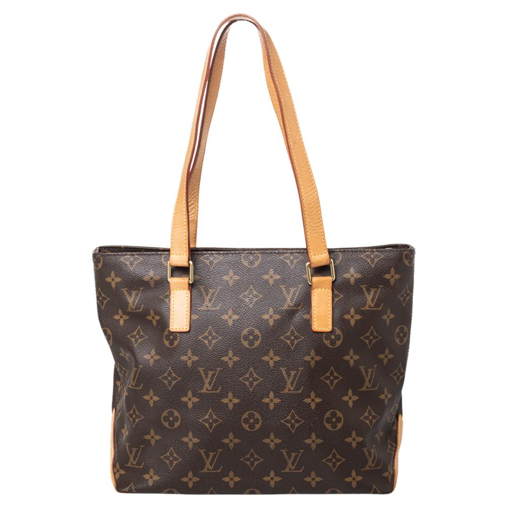 Louis Vuitton's Cabas Piano bag is both stylish and handy. Crafted from their signature Monogram canvas, the bag has two leather handles, a leather base, and a spacious canvas & leather interior that will comfortably hold all your essentials. This