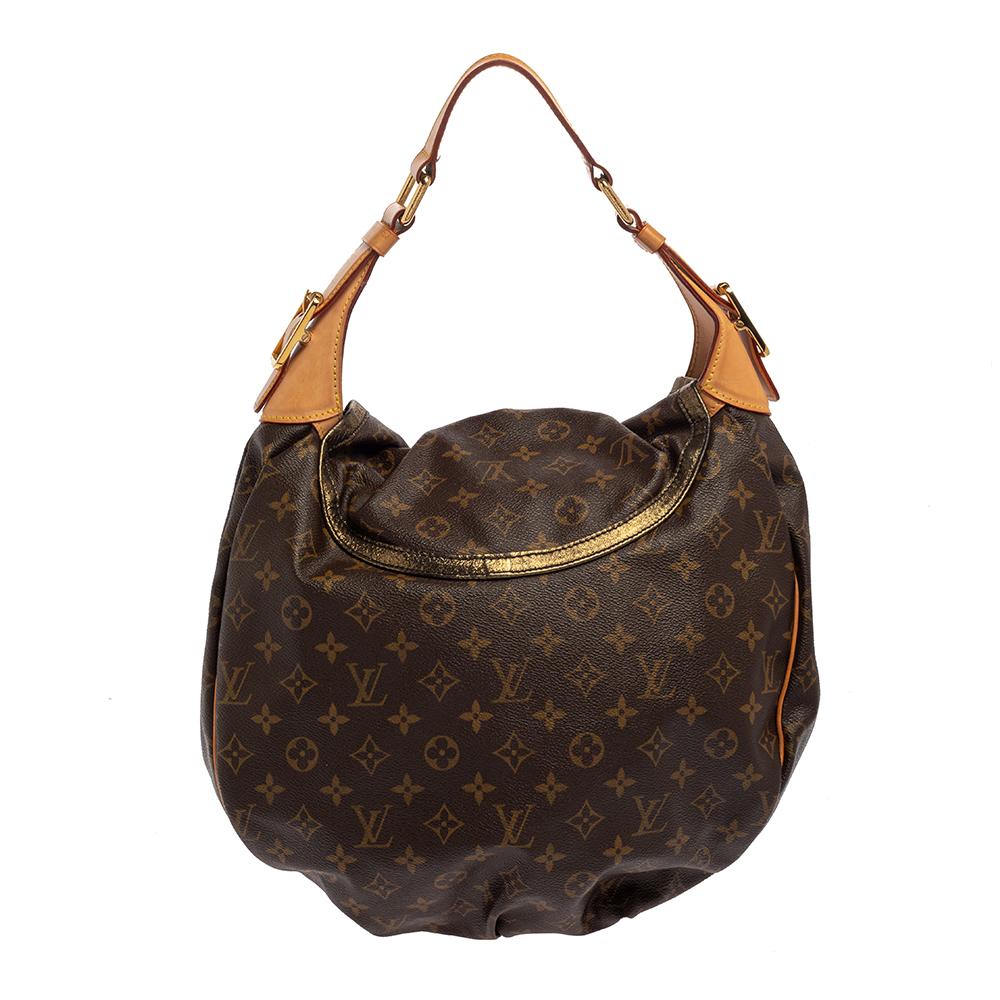 We rarely get to see a limited edition bag as gorgeous as this one. Every feature on it is luxe which makes the creation all the more worthy of being owned. This Louis Vuitton Kalahari GM bag has been crafted in France using Monogram canvas and