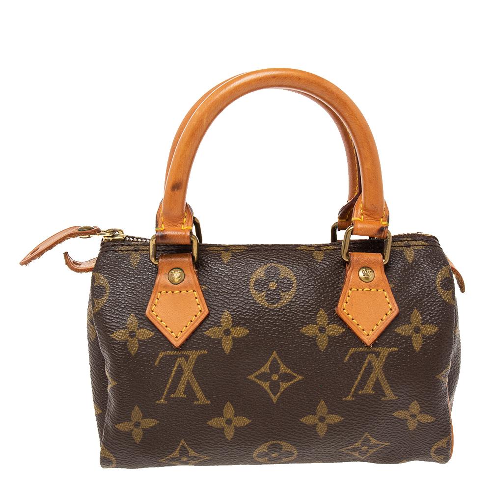 Highlight your look with this LV Mini Speedy bag. It is constructed using monogram canvas and leather into a sized-down version to be light and handy. The bag is added with gold-tone hardware and lined with fabric.

Includes: Brand Dustbag
