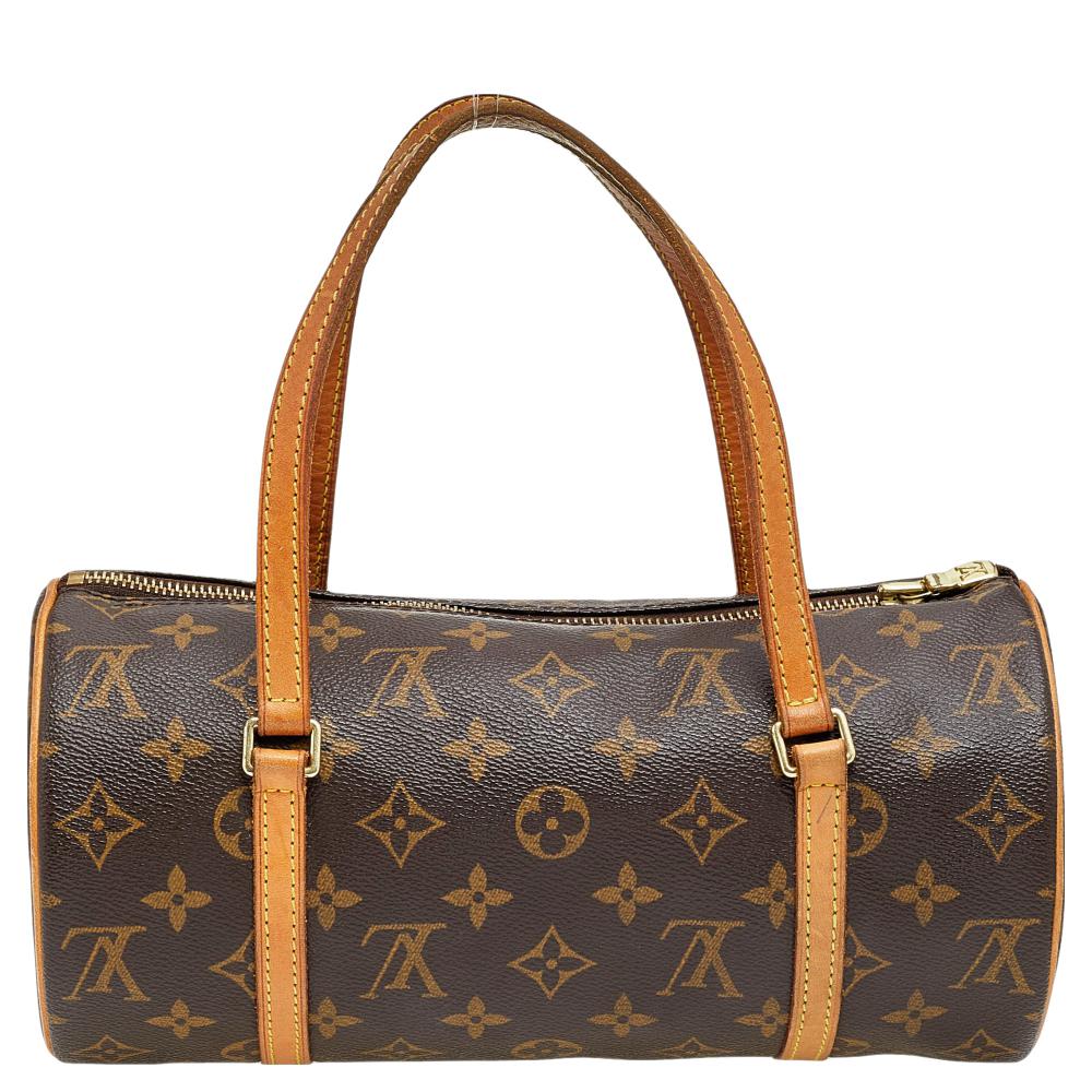 Like all other Louis Vuitton designs, this Papillon 26 bag too exudes never-ending charm and opulence and promises reliability and functionality. It is made from Monogram canvas and leather on the exterior, with gold-toned implements completing its
