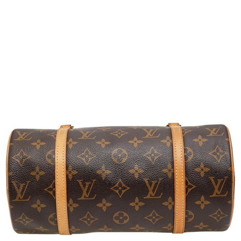 Louis VUITTON: Small leather and canvas travel bag with …