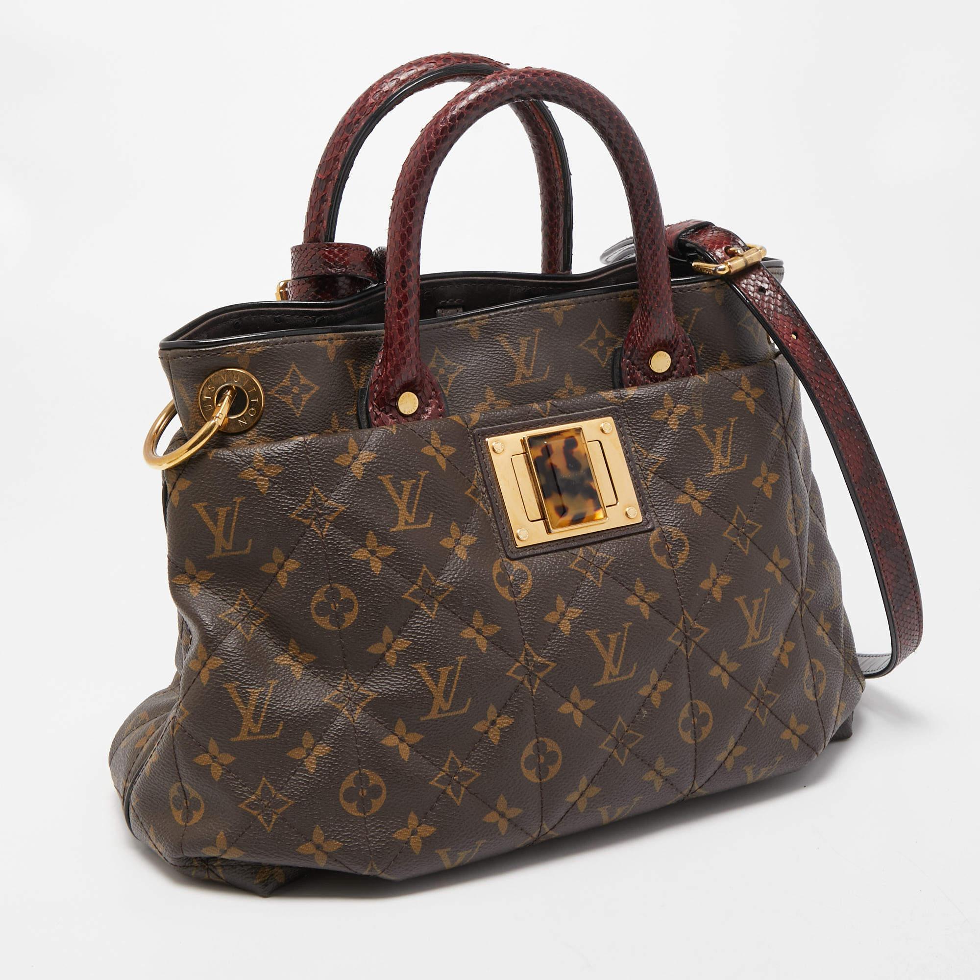 The luxurious and rare edition of the Etoile Exotique MM Bag from Louis Vuitton is crafted in the signature LV Monogram canvas. The tote comes equipped with python top handles and a shoulder strap that can be removed. Gold-tone hardware lends it a