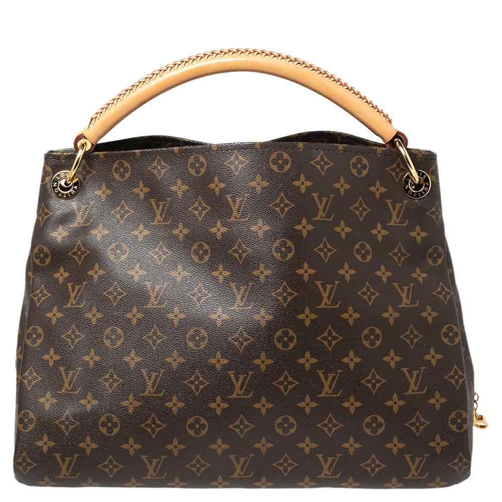 Flaunt this Louis Vuitton Artsy bag like a fashionista! Crafted from their signature Monogram canvas, this bag features an open top that reveals an Alcantara-lined interior, spacious enough to carry all your essentials. The bag is completed with a
