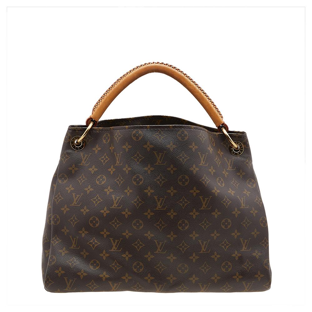 Flaunt this Louis Vuitton Artsy bag like a fashionista! Crafted from their monogram canvas and leather, this bag features an open top that reveals an Alcantara-lined interior, spacious enough to carry all your essentials. The bag is completed with a