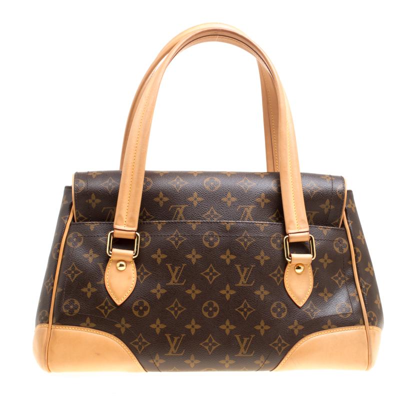 It is every woman's dream to own a Louis Vuitton handbag as appealing as this one. Crafted from their signature monogram canvas and tan leather trims, this bag features two handles and a flap with a push lock. While the gold-tone hardware elevates