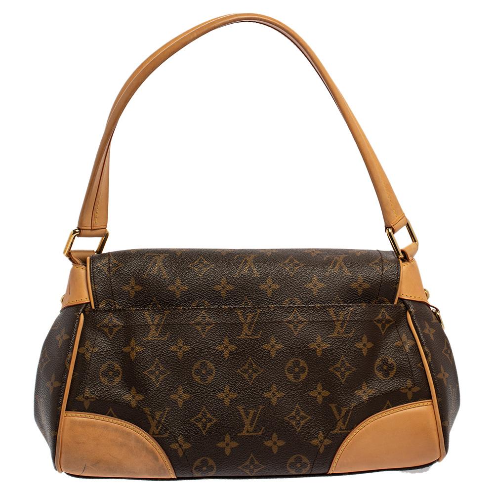 It is every woman's dream to own a Louis Vuitton handbag as appealing as this one. Crafted from their monogram coated canvas and leather, this bag features a top handle and a flap with a push lock. While the gold-tone hardware elevates its beauty,