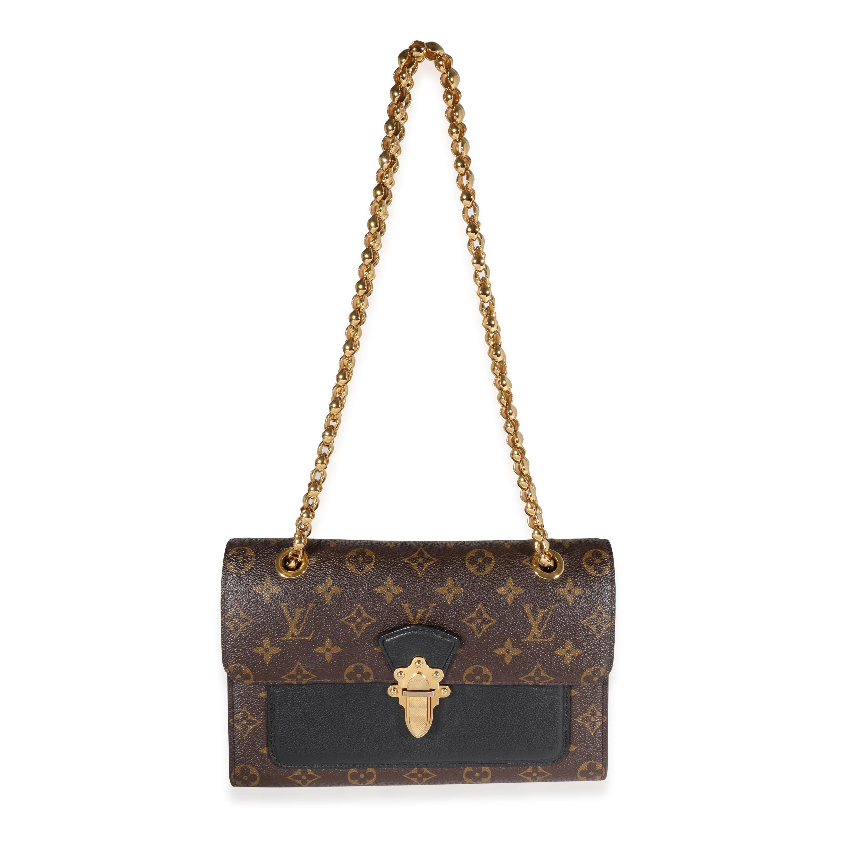 Listing Title: Louis Vuitton Monogram Canvas & Black Leather Victoire Bag
SKU: 121790
MSRP: 3100.00
Condition: Pre-owned 
Handbag Condition: Very Good
Condition Comments: Very Good Condition. Heavy scratching and tarnishing at hardware. Marks and