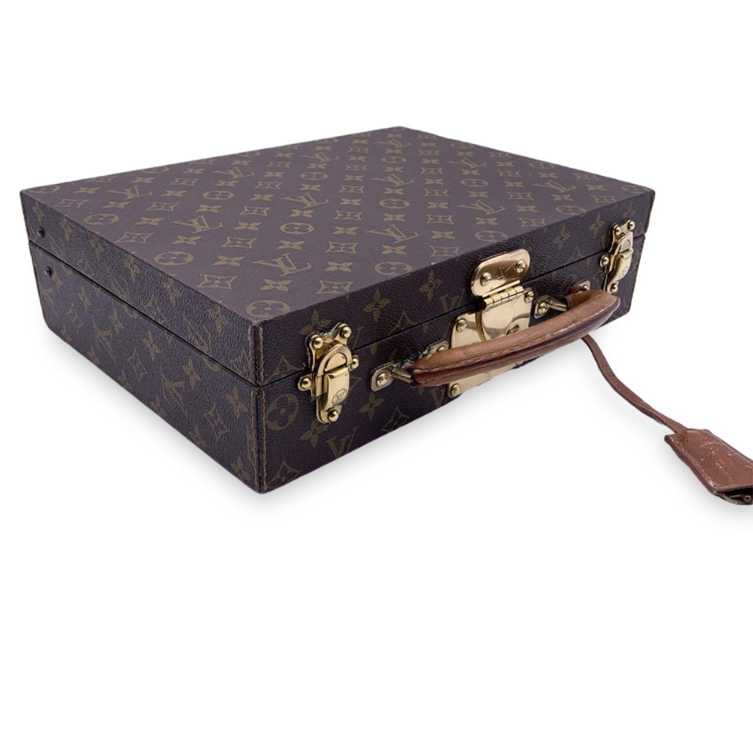 Indulge in the art of luxury travel with the Louis Vuitton Monogram 'Boite Bijoux' Jewelry Travel Trunk, a truly splendid and timeless accessory for the discerning traveler. Crafted from the iconic Louis Vuitton monogram canvas, this case is an