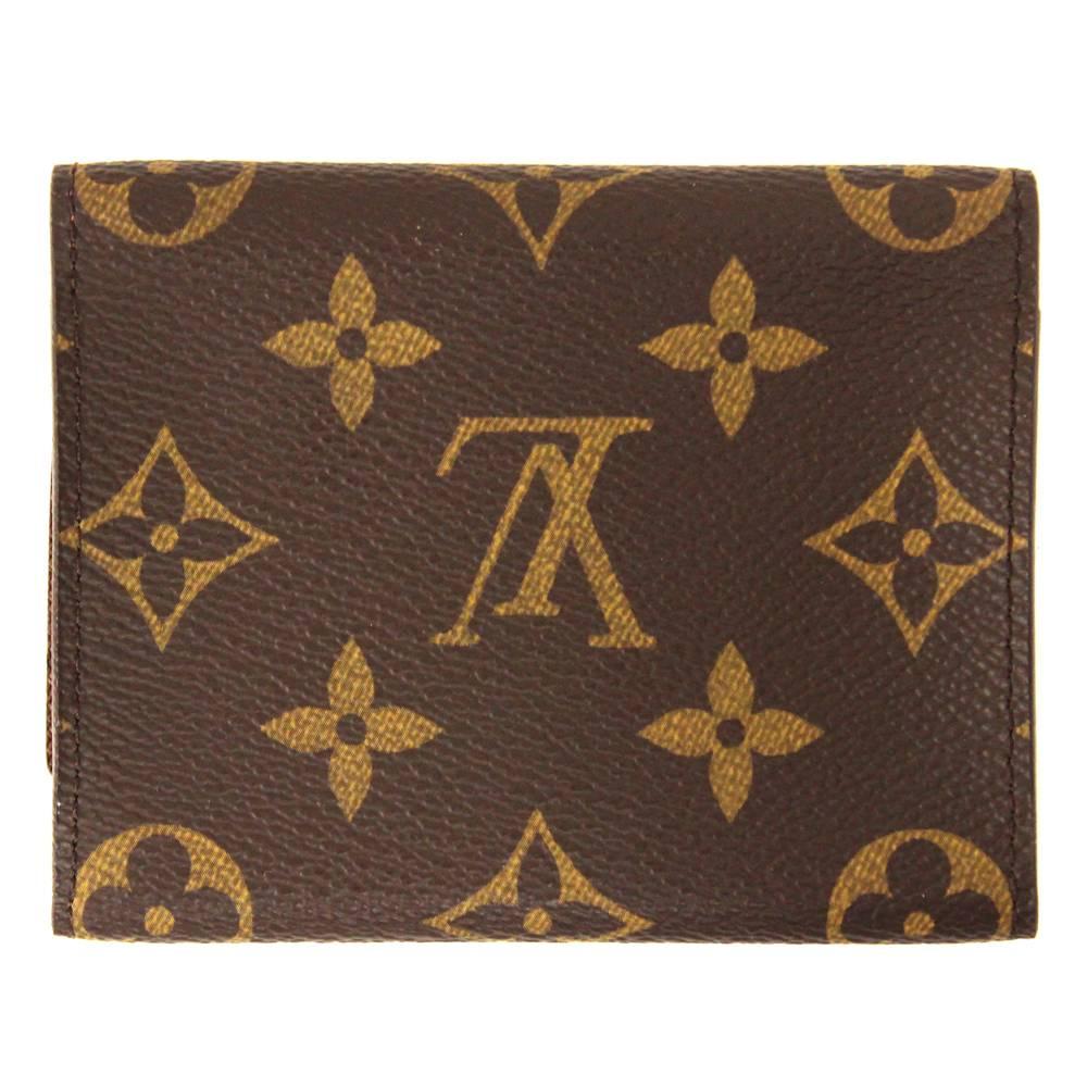 Louis Vuitton business card holder in his distinctive monogram canvas in brown. It features two internal compartments and a flat one under the flap. According to the code: CA 4018 the item was produced in 2008 and is in perfect conditions. It