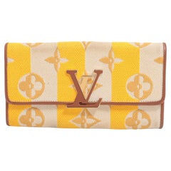 Louis Vuitton - Portefeuille Capucine en toile monogrammée rayé jaune beige