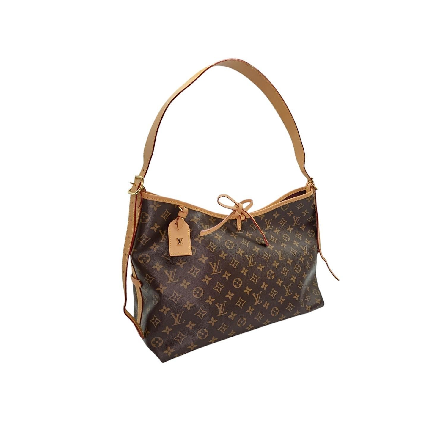 Elevate your style with this Louis Vuitton Monogram Carryall MM. Crafted with the iconic monogram coated canvas, this handbag is both luxurious and functional. The spacious interior features pockets for easy organization, and the adjustable leather