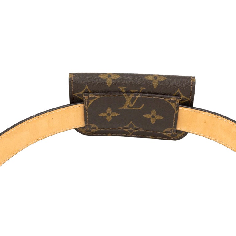 Louis Vuitton Monogram Canvas Ceinture Pochette Solo Belt Size 85, 2006. This iconic pochette is a piece of Louis Vuitton history that was first introduced in the the early 1900's as an accessory pouch to accompany larger bags. As the early 20th