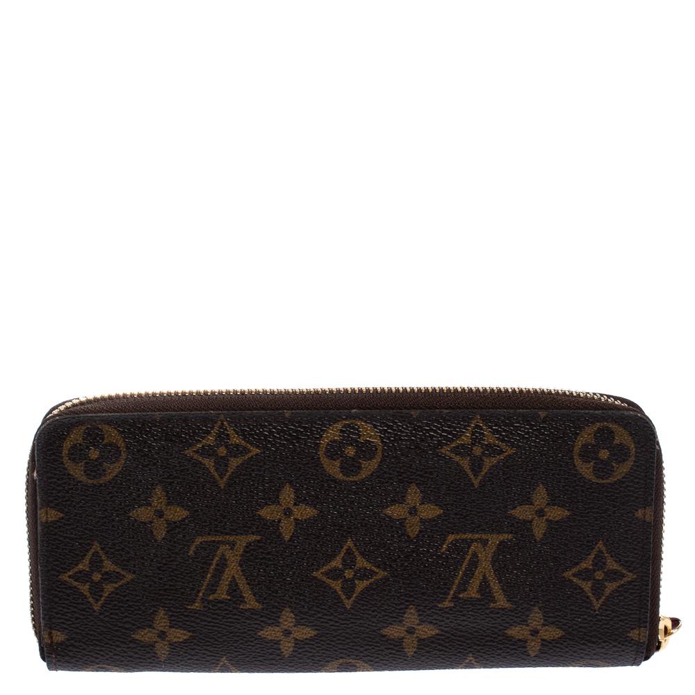 Fashionably put together, the brown hue of this wallet by Louis Vuitton gives it a signature feel. Crafted with monogram coated canvas, it is designed in a zip-around style with contrasting zip pulls. The insides are lined with leather and fabric
