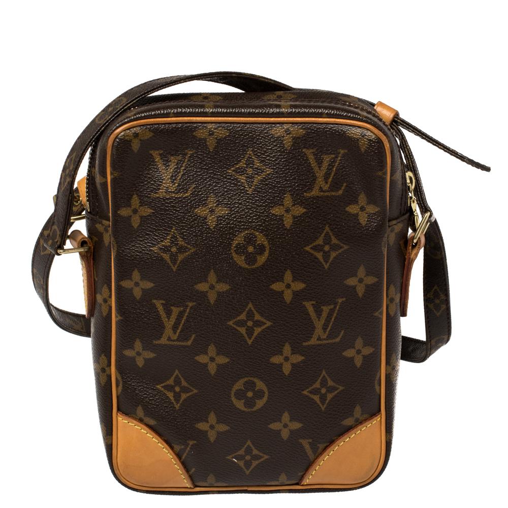 This Louis Vuitton Danube bag is ideal for flaunting this season. Its well-designed silhouette makes it practical and handy. Brought to life from monogram coated canvas and accented with leather trims, the bag has a top zipper closure and an