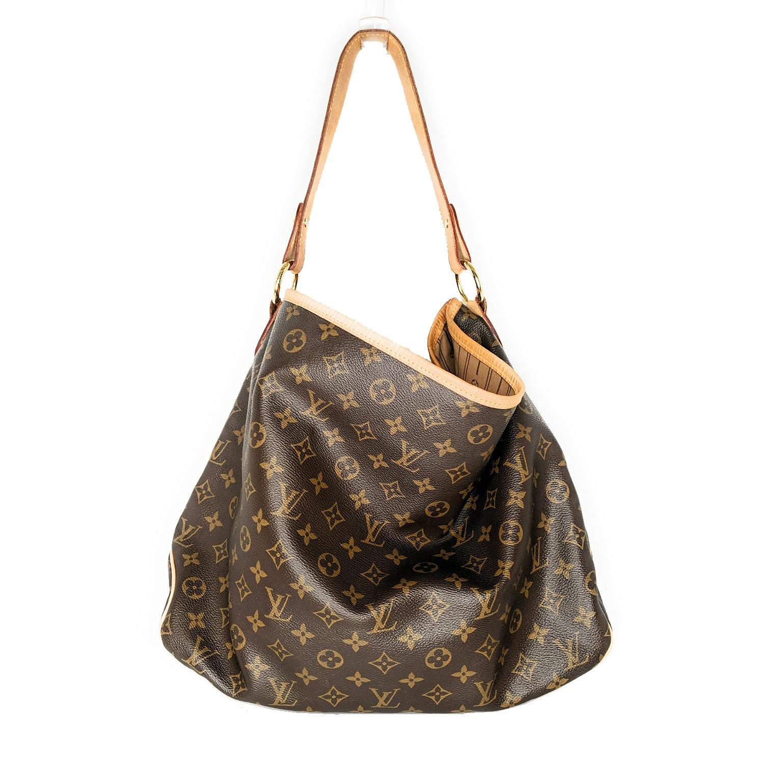 The Louis Vuitton Monogram Canvas Delightful MM Bag is hot off the press from Louis Vuitton and looks down-right glamorous in Monogram Canvas. It features a large yet lightweight design and feel with an extra spacious interior and one large side