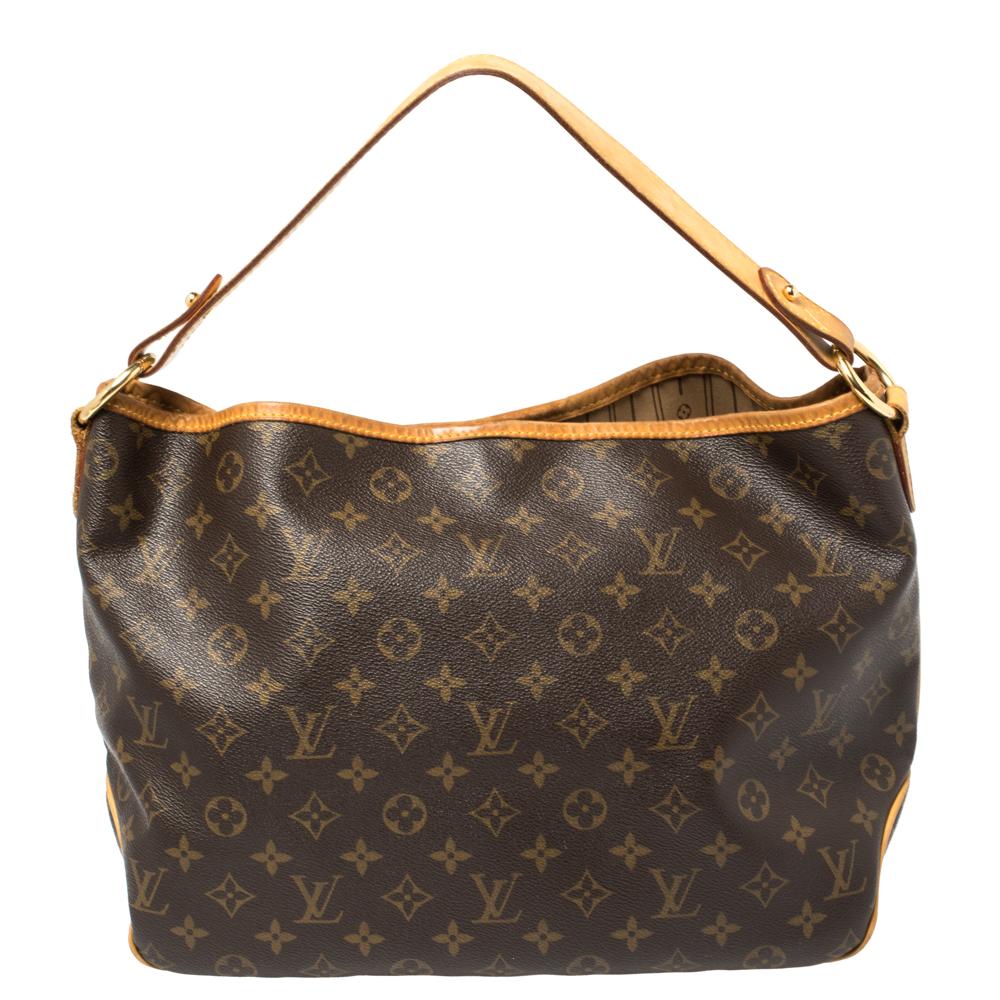 Adorned by a Louis Vuitton monogrammed surface recognizable from far and wide, this shoulder is a great pick to carry your everyday essentials with effortless ease. It is crafted from premium quality monogram canvas with a hook closure that secures