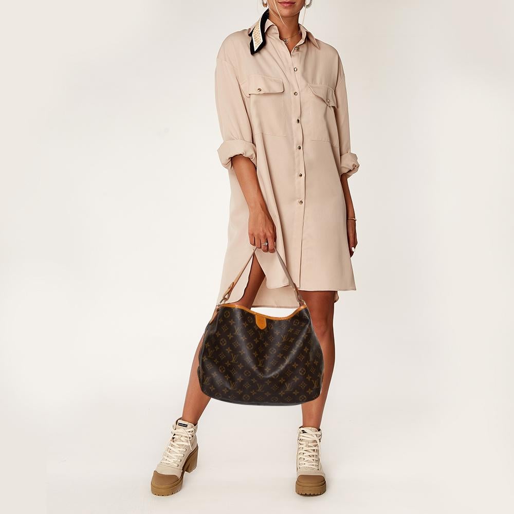 For years, women have been drawn towards Louis Vuitton's handbags when it comes to empowering their personal style. This Delightful bag, like all the other handbags, is durable and stylish. Crafted from the signature monogram canvas and leather, the