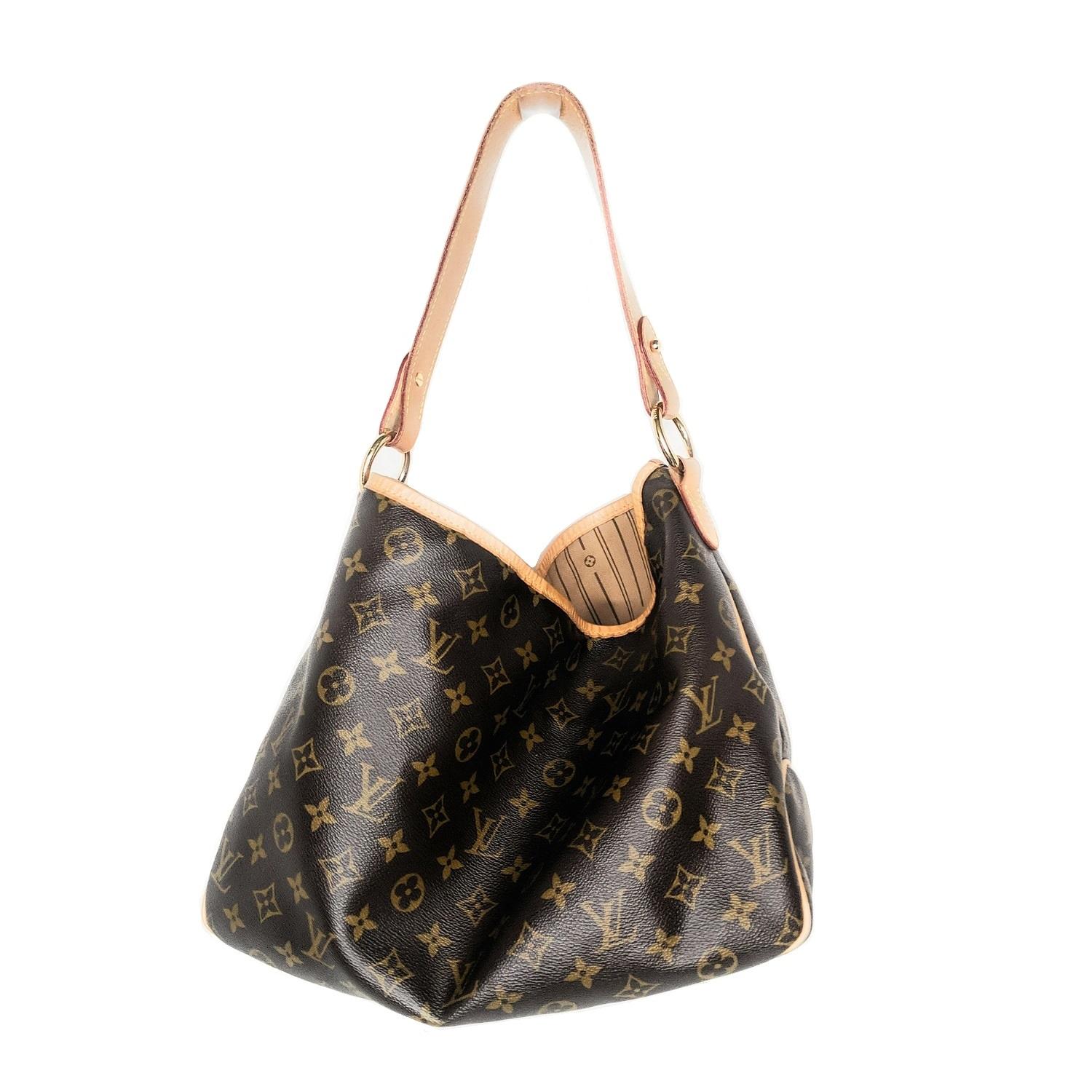 Brown and tan monogram coated canvas Louis Vuitton Delightful with brass hardware, tan Vachetta leather trim, single flat shoulder strap, brown and tan striped canvas lining, single zip pocket at interior wall and clasp closure at top. Retail price