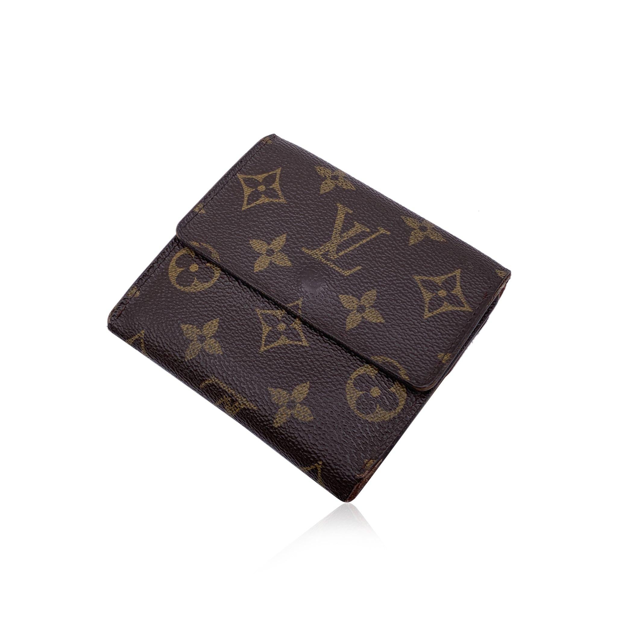 Louis Vuitton 'Elise' square-shaped wallet with double side flap, model M61654. Crafted in brown monogram canvas. Tan leather lining. 1 coin compartment on a side and a bifold section on the other side, with 1 bill compartment, 4 credit card slots