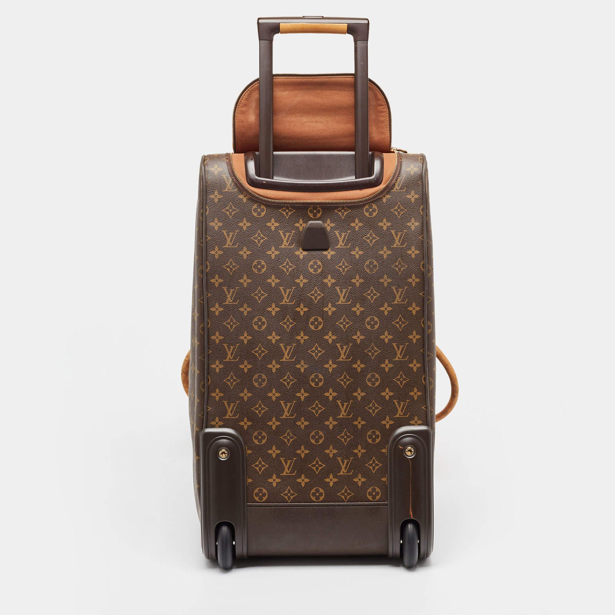 Featuring a chic yet luxurious style, this Louis Vuitton Eole 60 luggage bag is distinctive. Crafted from signature Monogram canvas, the bag is equipped with handles and trolly wheels and is secured by a zip closure. It offers a roomy interior to