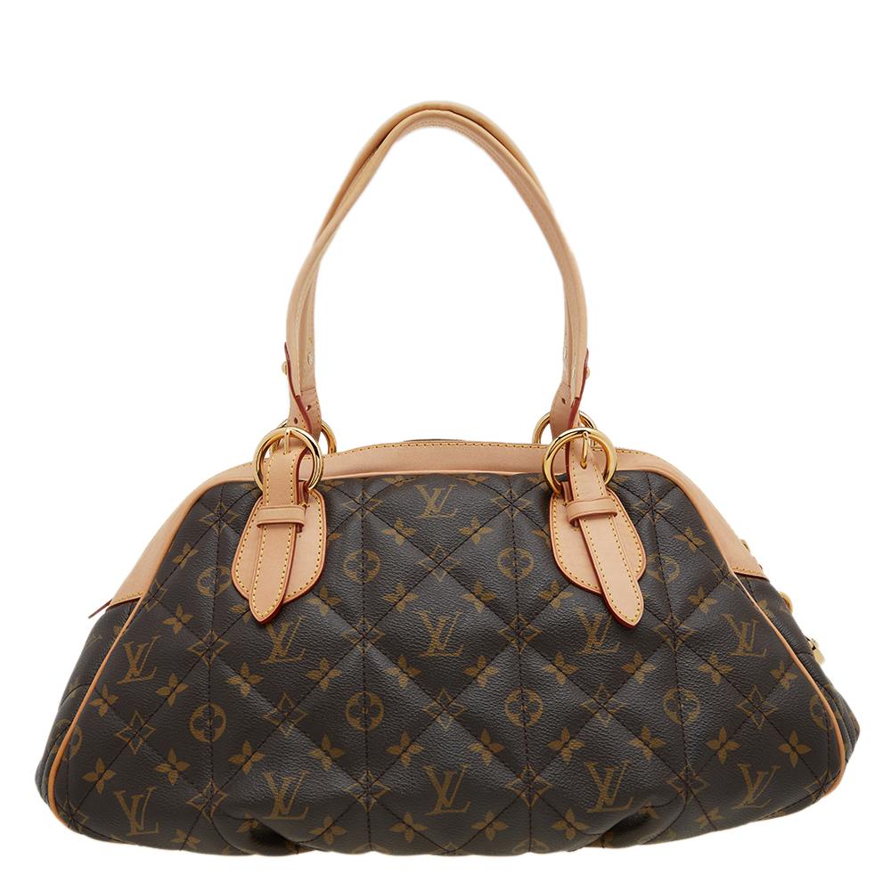 This Etoile Bowling bag by Louis Vuitton is a great rendition of an everyday staple. Made of monogram canvas and leather, it has a spacious compartment, two handles, and a gold-tone lock at the front. It is a fine accessory for daily use.

Includes: