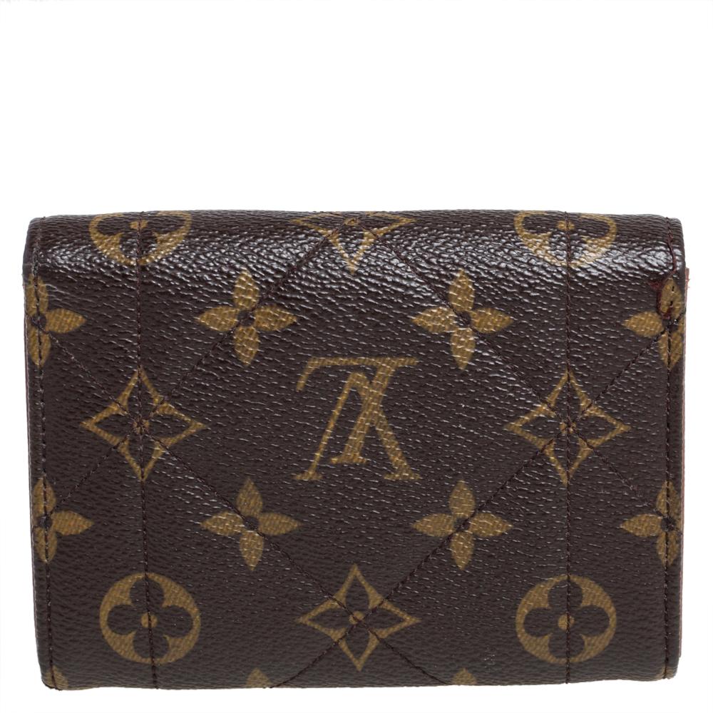 This classic wallet is from Louis Vuitton. The exterior is made from quilted monogram canvas featuring metal twist lock closure. Its well-organized interior is lined with leather and features a bill compartment, credit card slots, a zip pocket for