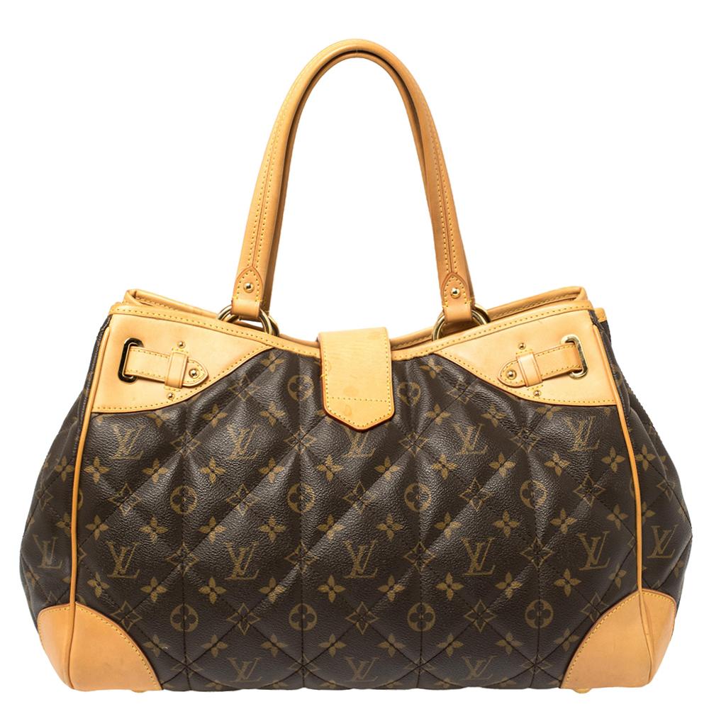 Louis Vuitton Etoile shopper bag is designed with a polished look and pleasing proportions. Crafted from monogram-coated canvas with triple quilting, it features leather trim and gold-tone hardware accents. It has a fold-over top strap and a