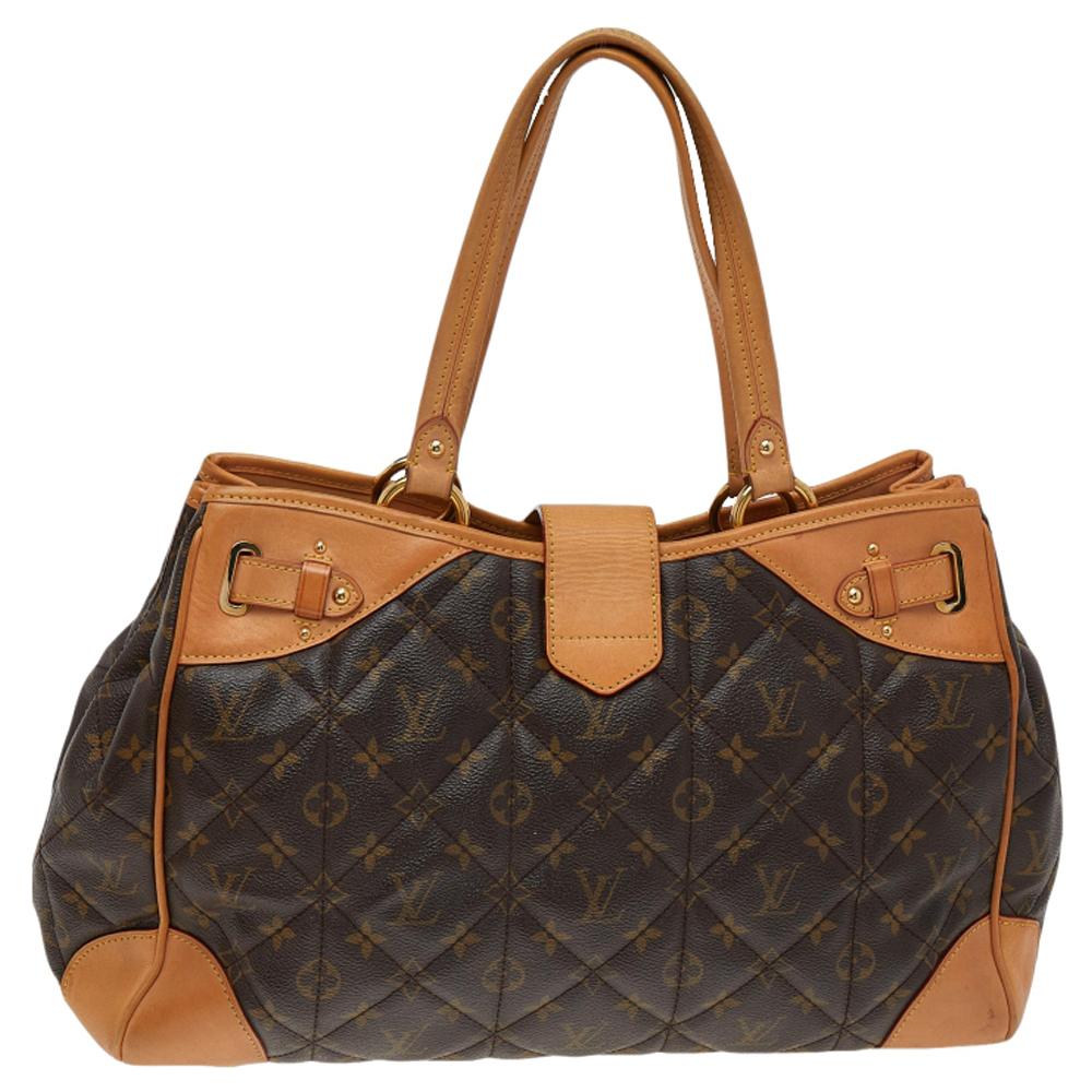 This Louis Vuitton creation has been beautifully crafted from their signature Monogram canvas and styled with a band flap that has a turn-lock. The insides are lined with suede and sized to hold all your essentials. The Etoile bag is equipped with