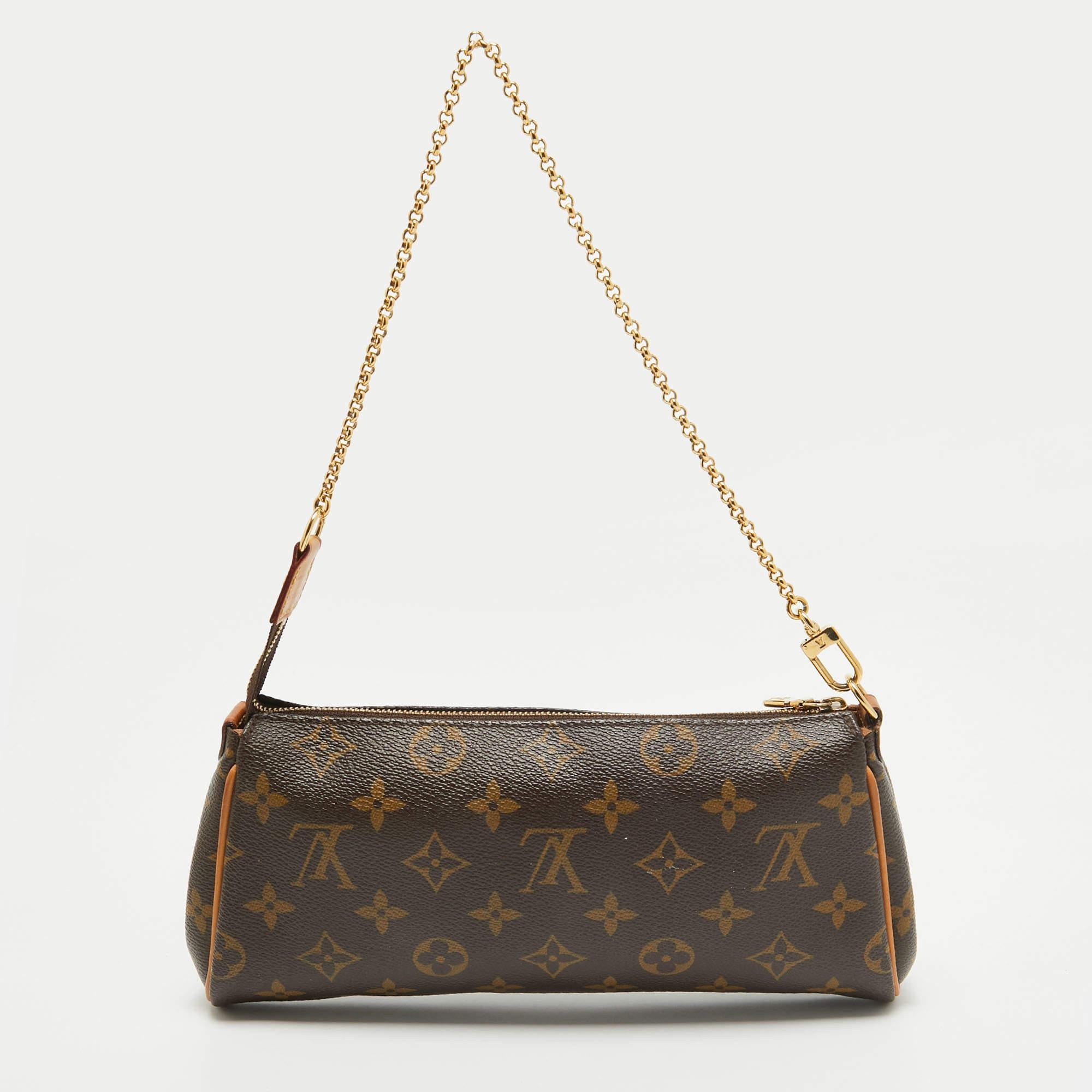 Crafted from Monogram canvas, this Eva Pochette bag is an adored creation by Louis Vuitton. The bag features a well-sized canvas interior that is secured by a gold-tone zipper. It comes with a chain and a leather strap.

Includes: Detachable Strap