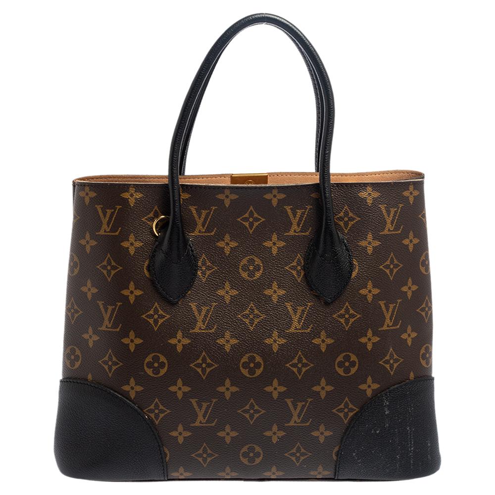 The classy Flandrin tote from Louis Vuitton is for all the fashionable women who love flaunting a chic style. This bag is made from the label's monogram canvas with leather edges and a gold-tone logo plaque to the front. The dual rolled handles on