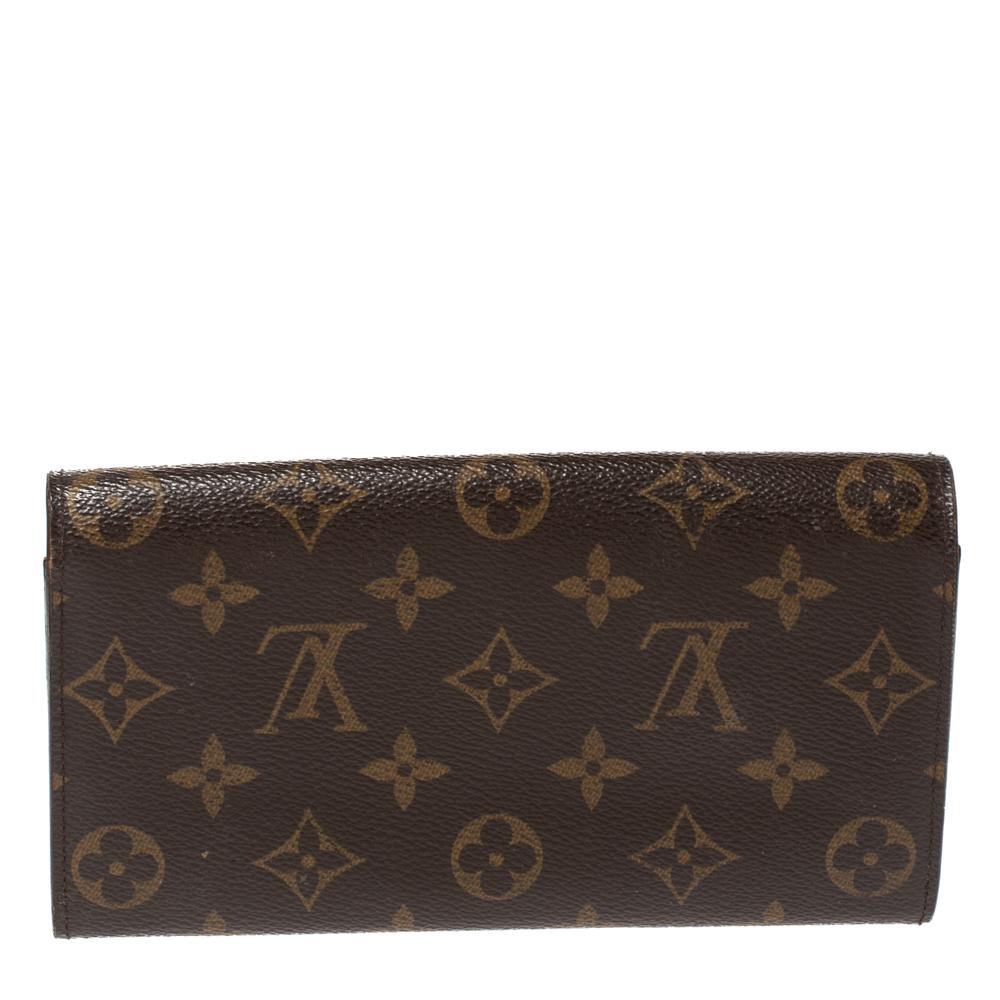 Suave and stylish, this wallet from Louis Vuitton effortlessly fits in your cards and cash. Made from monogram coated canvas, this wallet is a long-lasting accessory. The impeccable design and brown hue of this wallet impart a signature touch.

