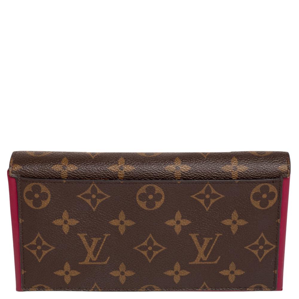 Functional luxury from Louis Vuitton, this Flore wallet is made from highly durable monogram canvas. Its exterior is designed in a simple flap style with a monogram flower detail. Neatly arranged storage including a series of card slots and a zip