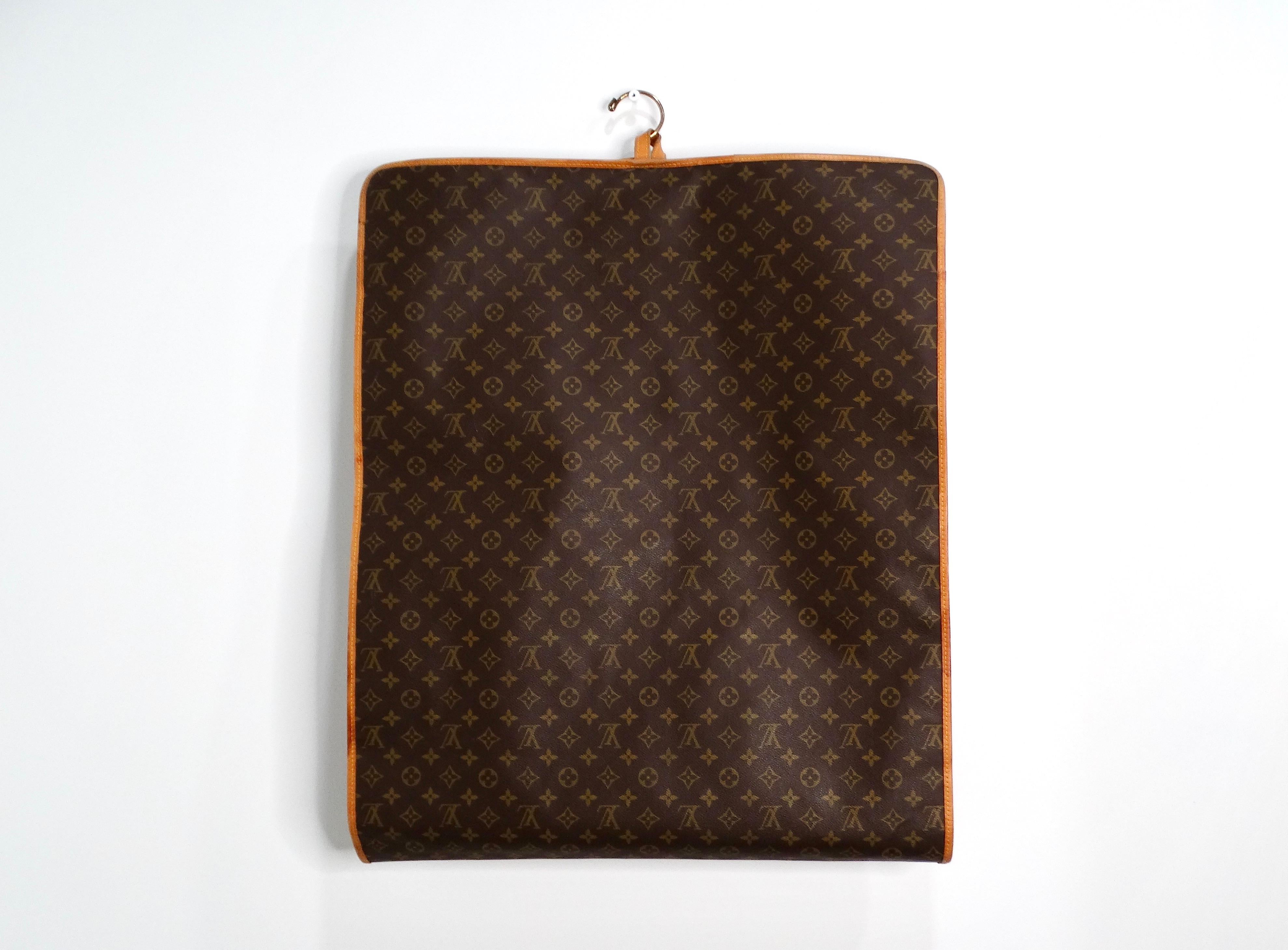 The Louis Vuitton Monogram Canvas Garment Bag is an epitome of luxury and sophistication, designed for the modern traveler who appreciates exquisite craftsmanship and timeless design. Crafted with leather on the outside, this garment bag showcases