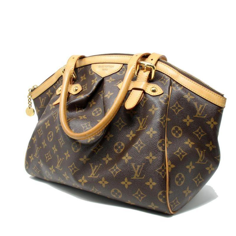 Louis Vuitton Monogram Canvas Gm Leather Tote Tivoli Shoulder Bag LV-0602N-0016

The Louis Vuitton Monogram Canvas Tivoli GM has fashion and functionality all rolled into one. With its adjustable side gussets and roomy capacity, it is perfect for