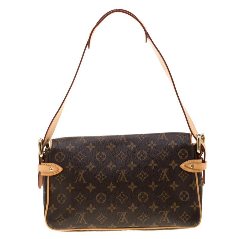 This Hudson PM by Louis Vuitton is a handbag you can carry for years to come. It features easy-to-match monogram canvas exterior with leather trims, dual push button front pockets, flap front buckle closure and a single leather shoulder strap. The