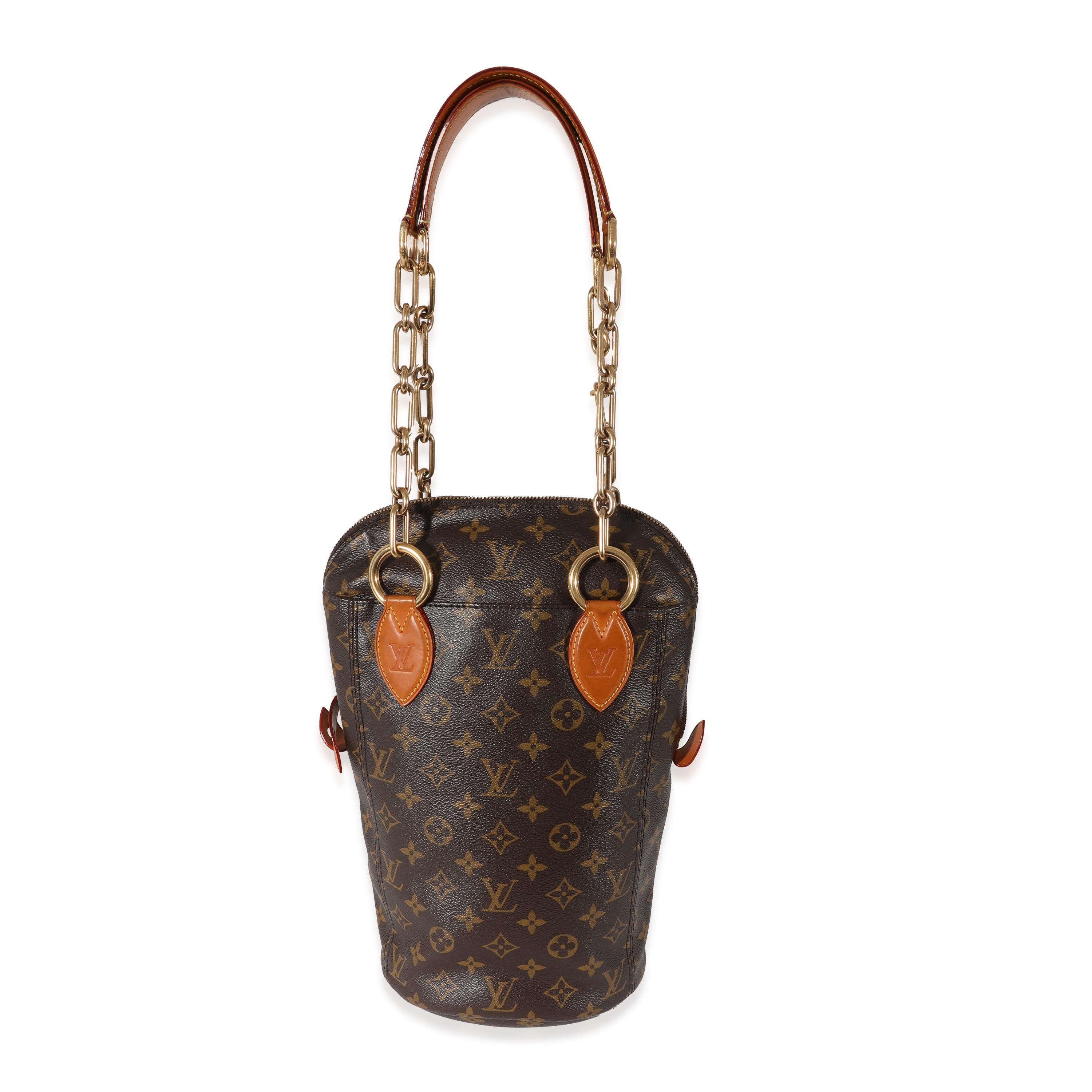 Listing Title: Louis Vuitton Monogram Canvas Iconoclasts Karl Lagerfeld Baby Punching Bag
SKU: 130240
Condition: Pre-owned 
Handbag Condition: Very Good
Condition Comments: Item is in very good condition with minor signs of wear. Heavy patina at