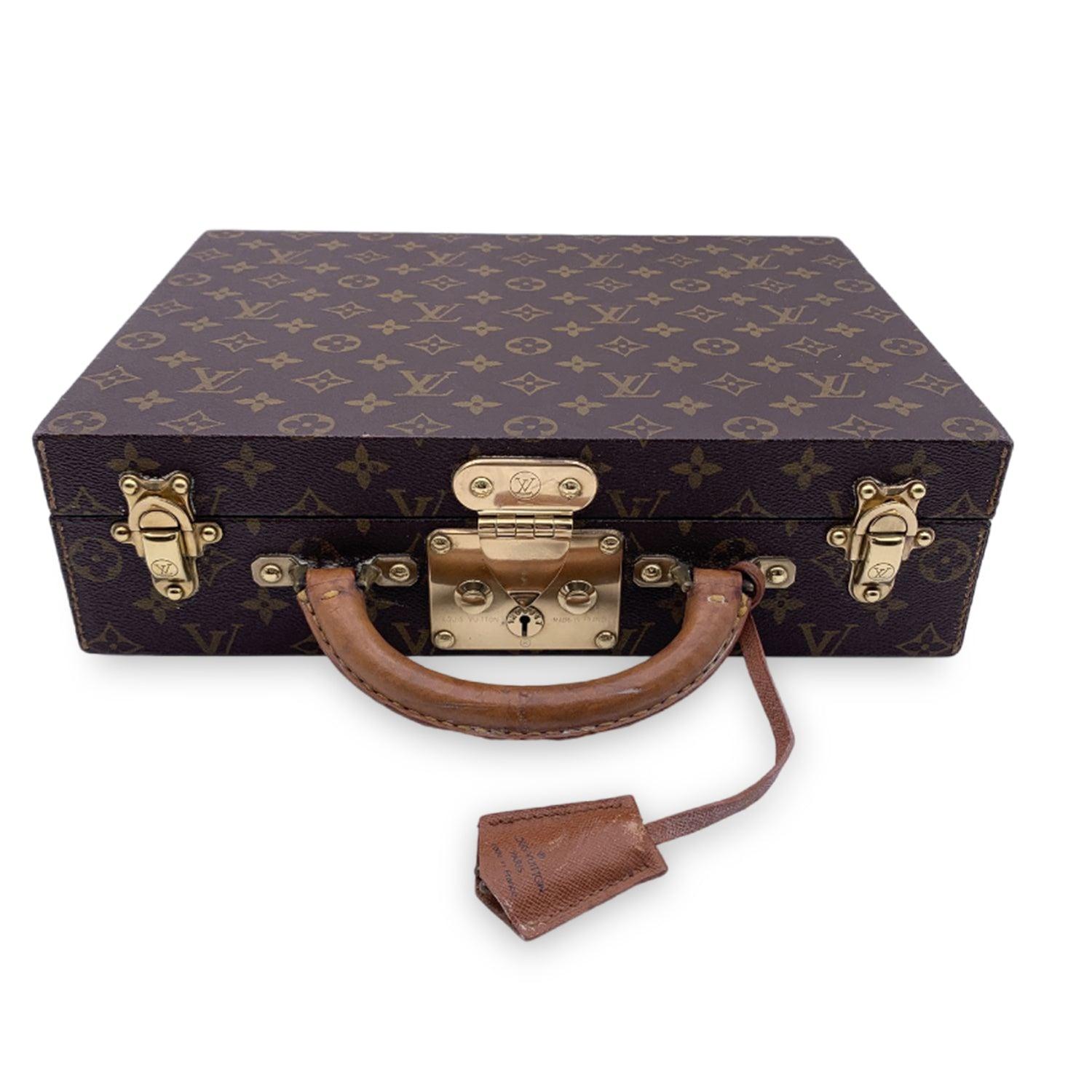 Indulge in the art of luxury travel with the Louis Vuitton Monogram 'Boite Bijoux' Jewelry Travel Trunk, a truly splendid and timeless accessory for the discerning traveler. Crafted from the iconic Louis Vuitton monogram canvas, this case is an