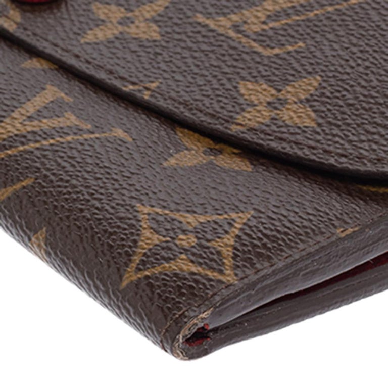 This Josephine wallet by Louis Vuitton is crafted fabulously from the signature monogram canvas. It features gold-tone hardware and red leather interiors. The top flap closure opens to an interior that is spacious enough to house all your basics.

