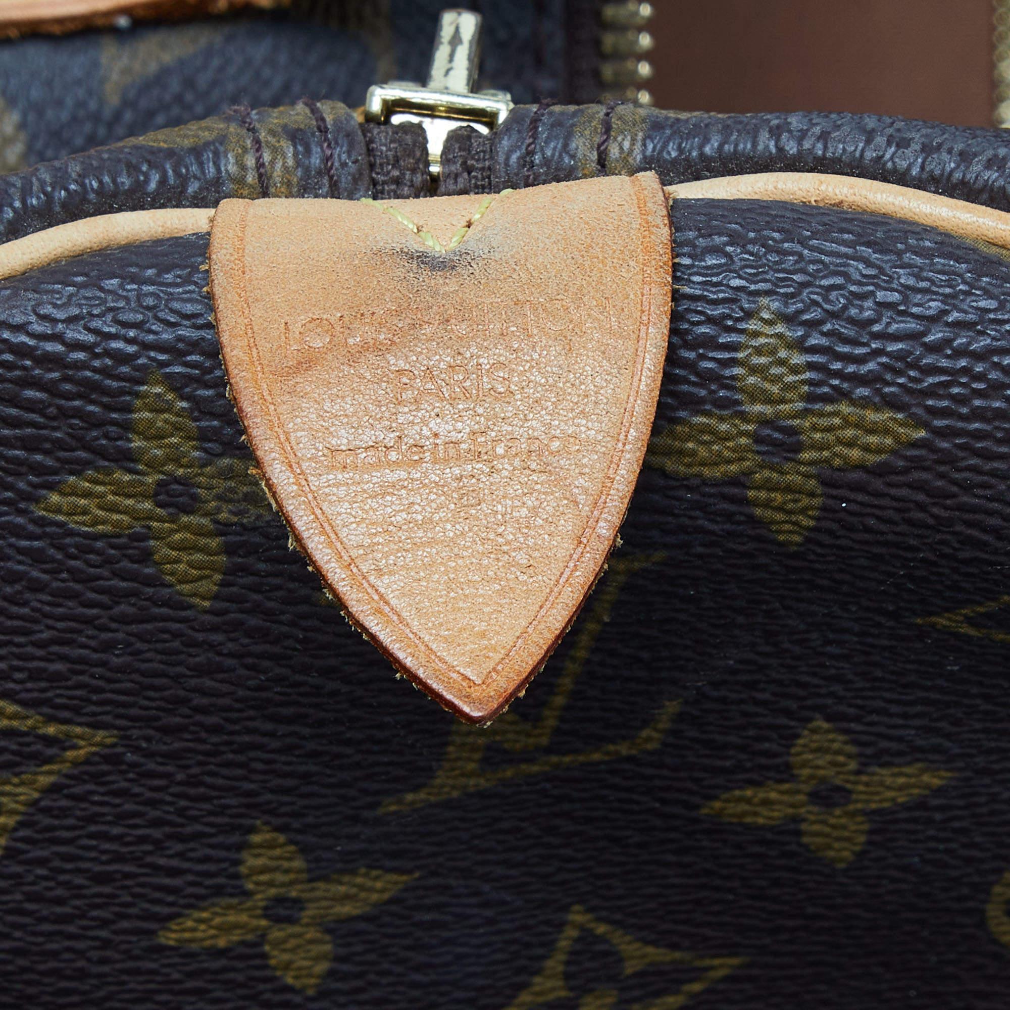 Louis Vuitton - Sac Keepall Bandouliere 60 en toile avec monogramme en vente 9