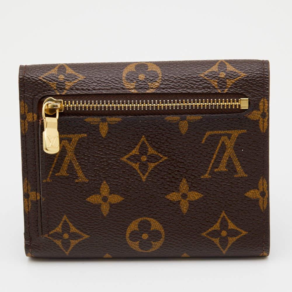 Store your monetary essentials hassle-free in this wallet from Louis Vuitton. Durable and stylish, it is crafted from Monogram canvas into a functional design and secured by a gold-tone lock.

