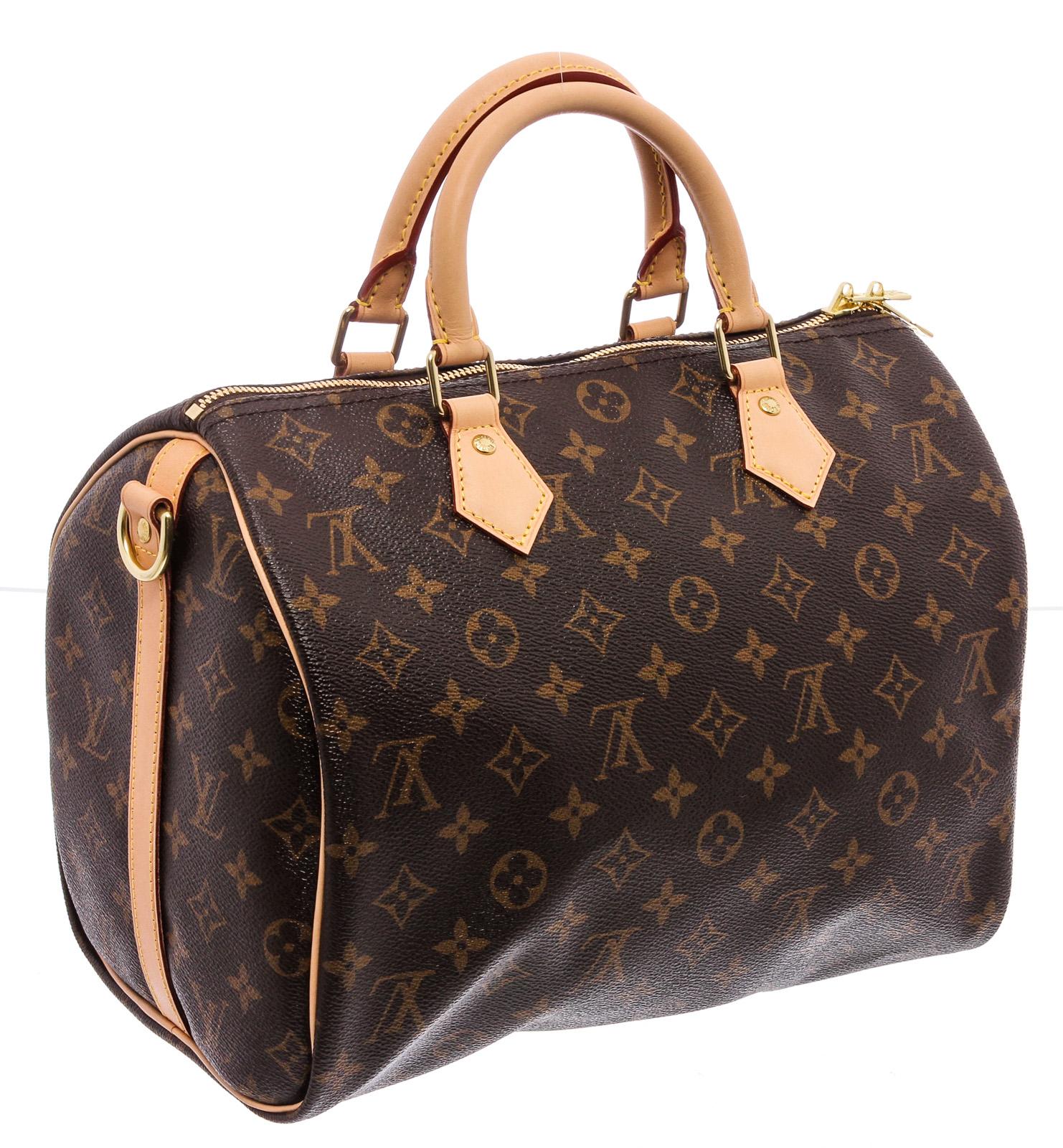 Brown and tan monogram print coated canvas Louis Vuitton Speedy 30 Bandoulière with brass hardware, dual rolled top handles, single optional adjustable flat shoulder strap, tan Vachetta trim, light brown woven lining, single slit pocket at interior