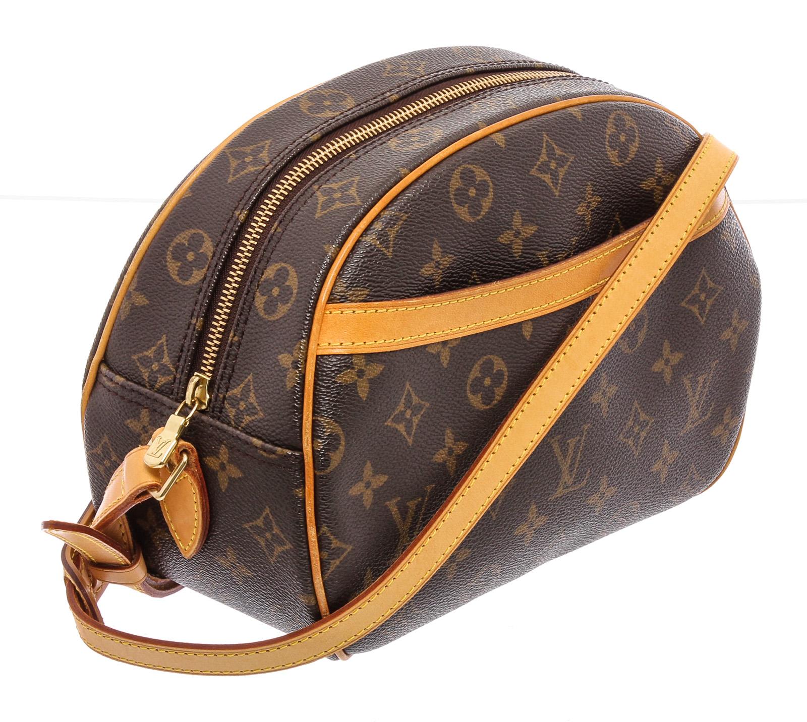 Brown and tan monogram coated canvas Louis Vuitton Blois bag with brass hardware, tan vachetta leather trim, flat shoulder strap, exterior pocket at front, brown leather lining, single slit pocket at interior wall and zip closure at top. 

21877MSC