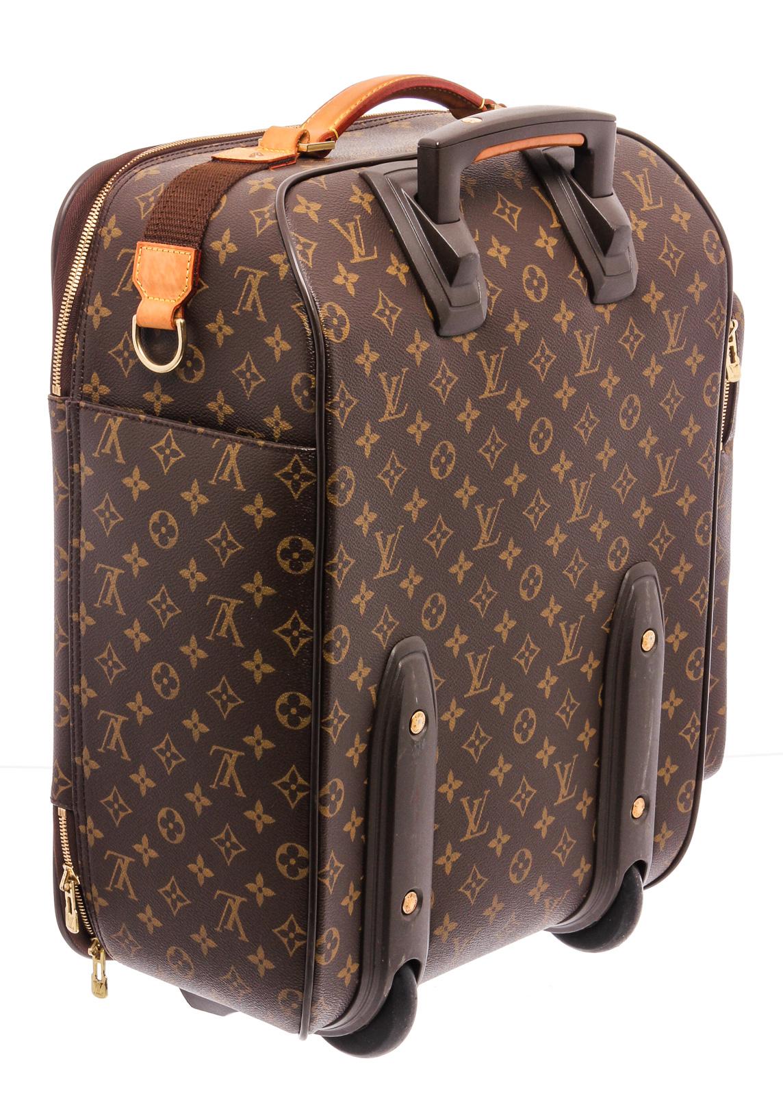 Brown monogram coated canvas Louis Vuitton Bosphore Trolley 45 with brass hardware, tan vachetta leather trim, retractable pull handle at top, flat handle at side, exterior zip pocket at side featuring five holster straps, slit and zip pocket at