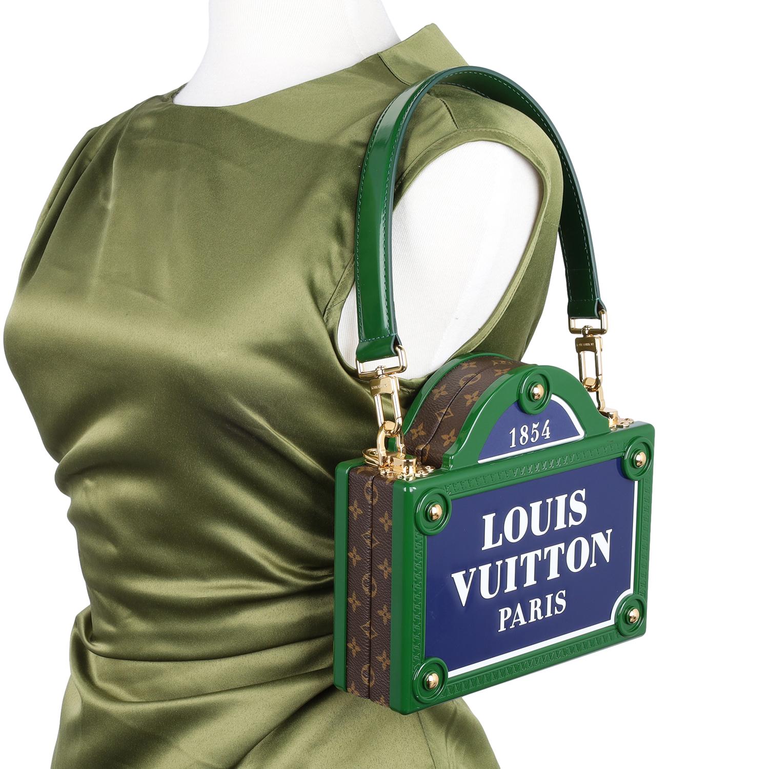 Authentic Louis Vuitton Petite Malle Verical Monogram Canvas.

Limited Edition.

Nicolas Ghesquière celebrates Paris with a fresh take on the Petite Malle handbag, featuring a pediment design inspired by Parisian street signs. Framed in green with